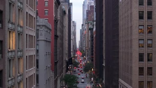 Aerial View of Midtown Manhattan Buildings Windows Tracking Vehicle Movement Beneath Towering