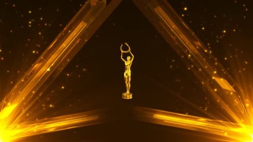 Golden trophy statue with sparkling lights on dark background