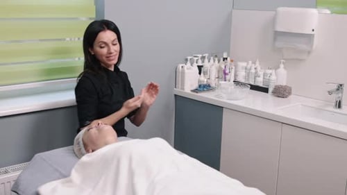 Woman Receives Facial Massage in a Medical Spa