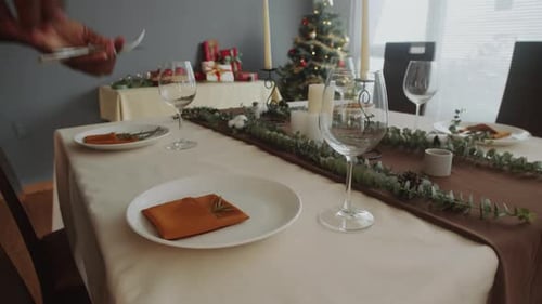 Setting Festive Christmas Dinner Table for Family