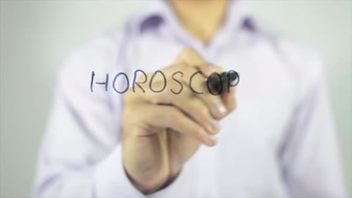 Writing Horoscope On Clear Surface