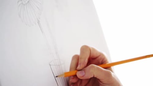 Art Creativity and People Concept - Artist Hand with Graphite Pencil Drawing