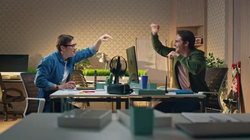 Happy Coworkers Giving Five to Each Other at Computer Table Guys Enjoying Break