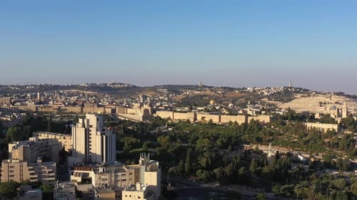 The old city of Jerusalem walls at sunset, aerial view