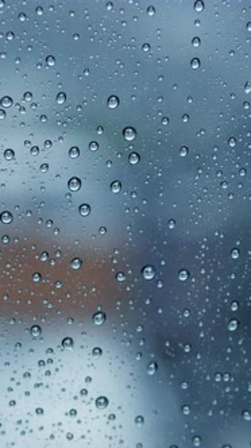 Raindrops on Window Obscuring Urban Cityscape