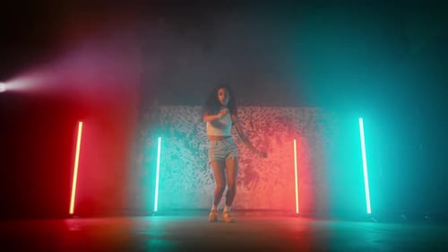 Selfconfident Black Woman in Sexy Gown Dancing Alone in Dance Studio Portrait Attractive Mixed Race