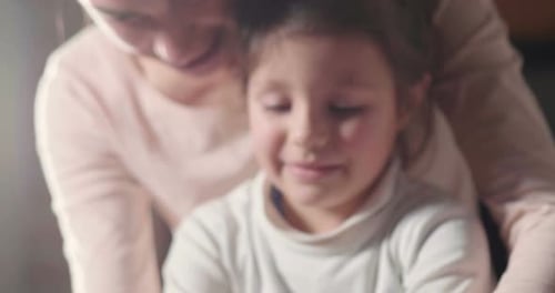 Woman and Child Create Pottery Together