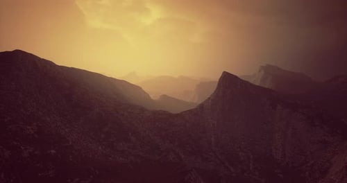 Majestic Mountain Landscape at Dusk with Dramatic Lighting and Shadows