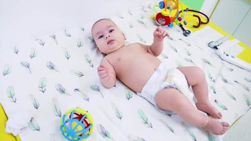 Infant Lying on a Changing Table in Hospital