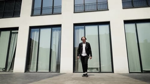 The Brutal Gait of a Man with Glasses