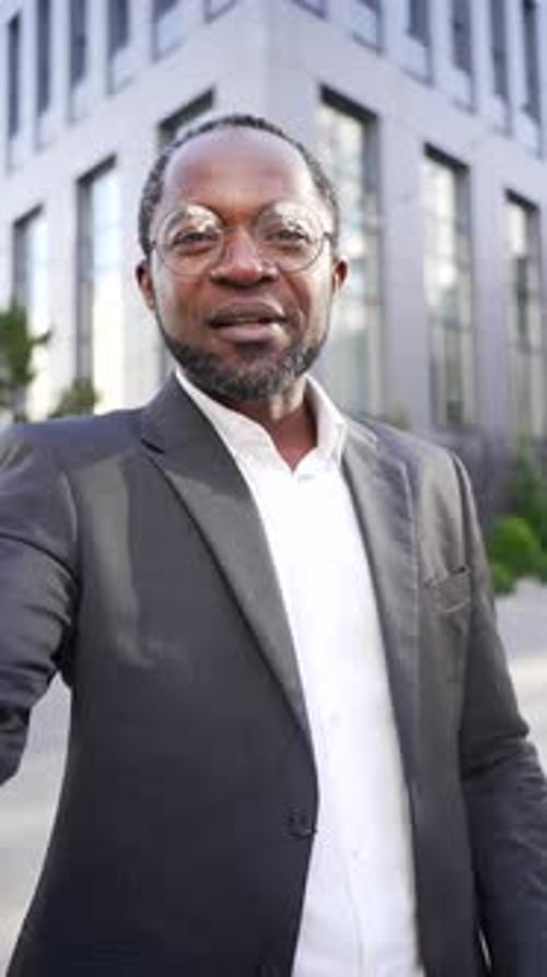 Professional Man Speaking to Camera in Urban Setting