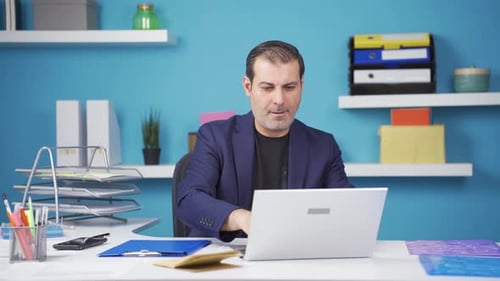 Excited Man Celebrating Good News in Office