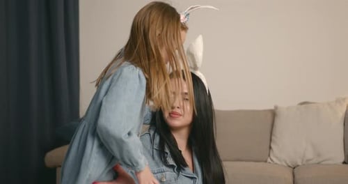 Mother and Child Wearing Bunny Ears Embrace