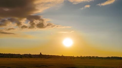 Time Lapse Fast Moving Clouds Over Agricultural Wheat Field Timelapse Sunset on Mown Harvested Hay