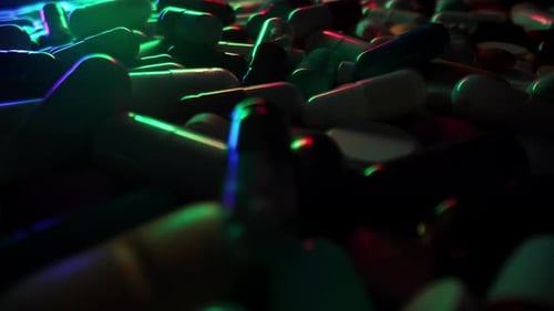 Pills and Capsules Glowing in Neon Lights