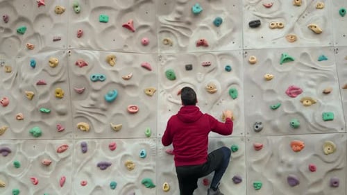 Man Indoor Rock Climbing Training