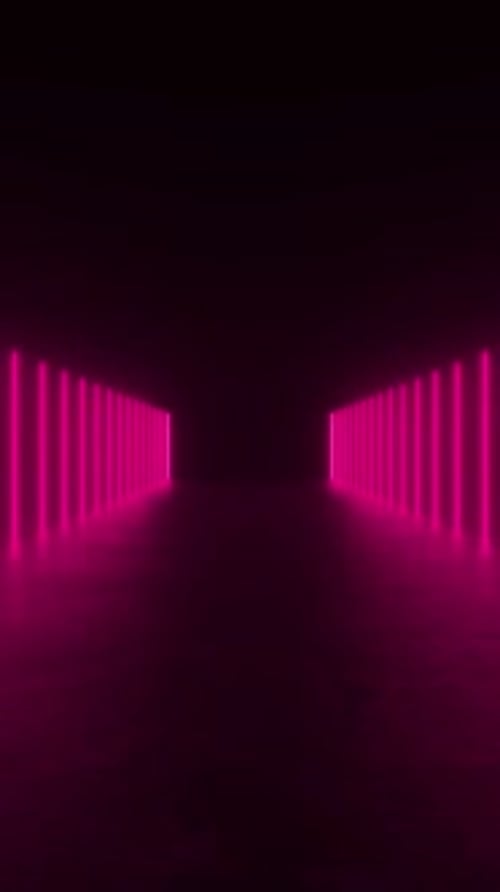 Explore a tunnel of pink neon lights in a dark room, creating a futuristic and captivating ambiance.