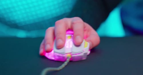Hand Clicking a Glowing Computer Mouse