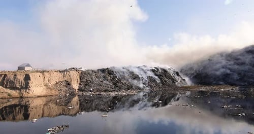 Burning Trash Pile Pollutes Urban Environment