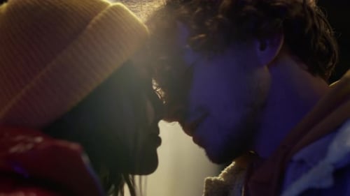 Happy Couple Touching Noses Against City Lights Outdoor. Closeup Man and Woman