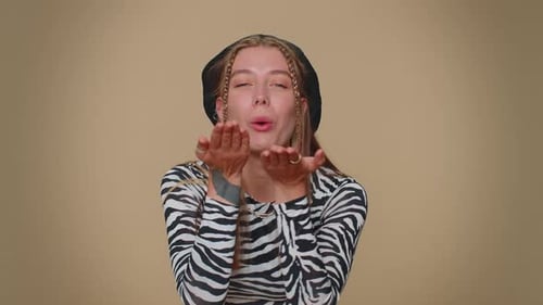 Smiling Romantic Pretty Girl Sending Air Kisses Looking at Camera and Smiling Missing you Love