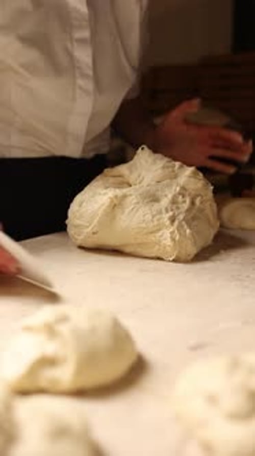 A baker prepares delicious bread. Close-ups