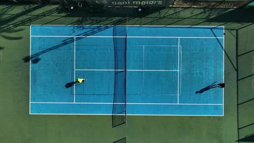Aerial View of Adults Playing Tennis on Court
