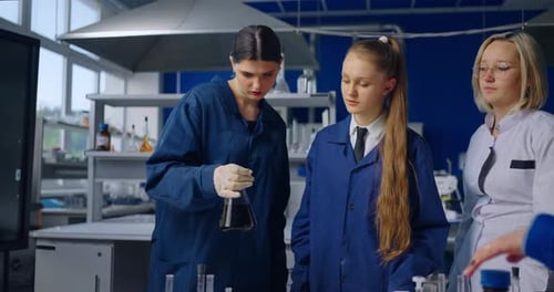Students Conduct Science Experiment in Bright Laboratory