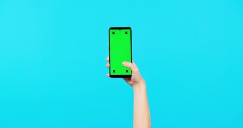 Person, hands and phone mockup for social media, advertising or marketing against a blue studio