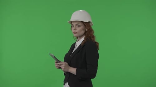 A Woman Architect Conducts an Inspection of the Object and Takes Notes in the Tablet Business Woman