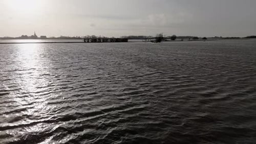 Submerged road Along the Flooded Riverbanks with backlight