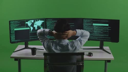 Asian Man Having Headache While Write Code With Multiple Computer Screens In Green Screen