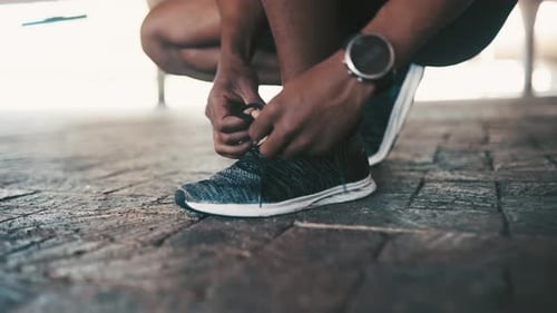 Hands tie shoelace, person ready for run and fitness outdoor for cardio, health and wellness