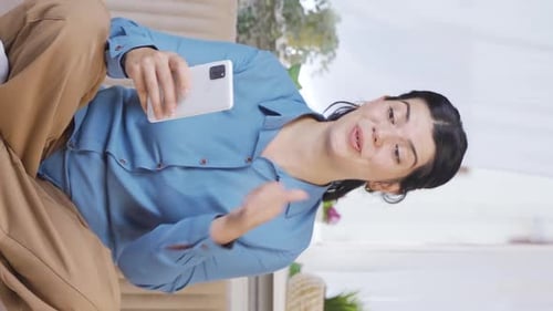 Vertical video of The woman who reads the good news.
