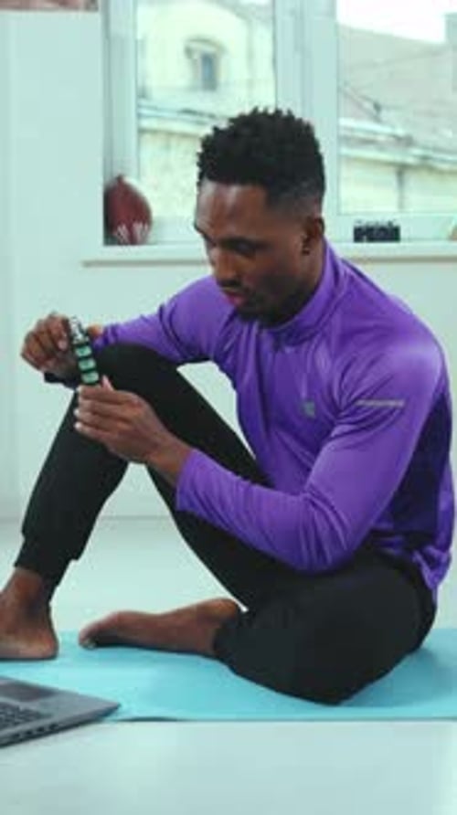 A Man Actively Engaging in His Fitness Routine From the Comfort of His Home Space