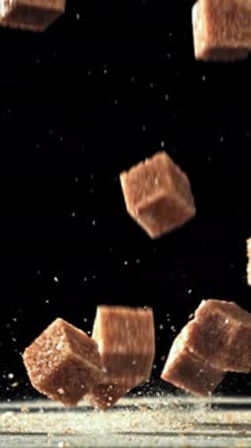 Cane Sugar Cubes Fall on the Table Filmed on a Highspeed Camera at 1000 Fps