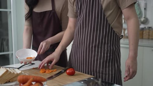 Couple Preparing Fresh Vegetables Together in Kitchen