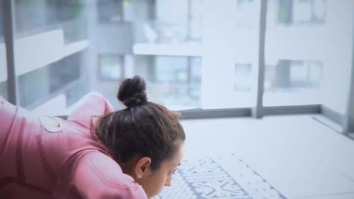 Woman Does Cobra Pose in Apartment