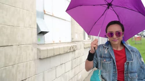 Stylish Woman Walking with Roller Skate and Umbrella