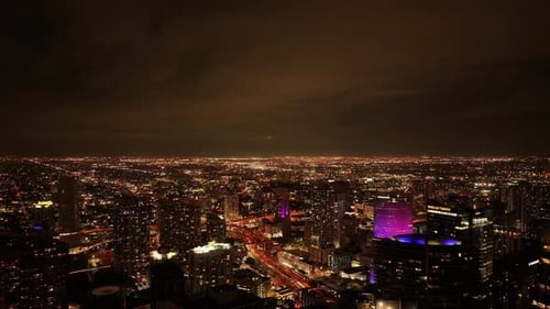 Aerial view of vibrant downtown skyline at night, United States.