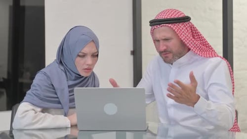 Business People Working on Laptop in Office