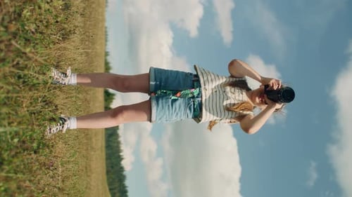 Child Takes Photograph With DSLR Camera Outdoors