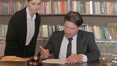 Team of Lawyers Working on Legal Documents in Office