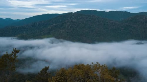 Time Lapse Of Low Clouds And Fog Over Mountain Or Landscape and Small Village