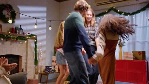 Happy Family Dancing Together at Christmas Time