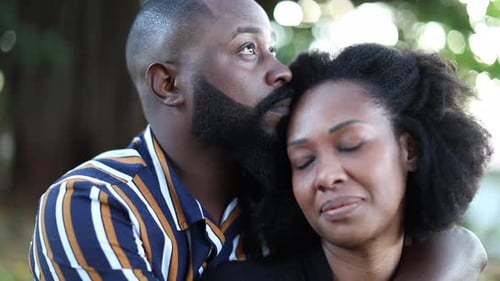 Affectionate Couple Embracing Outdoors in a Garden