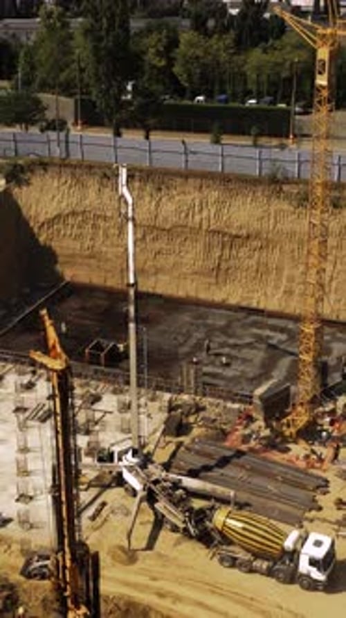 Construction Workers Building Foundation Aerial View