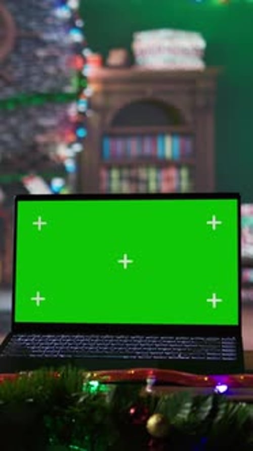 Vertical Video Warm Festive Empty Log Cabin with a Green Screen Running on Laptop