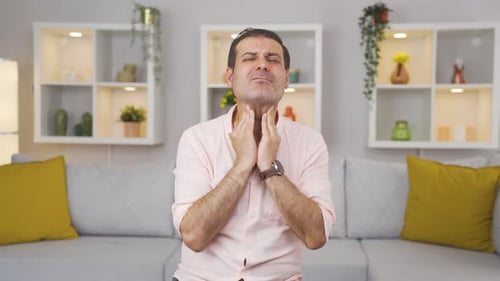 Man with sore throat.