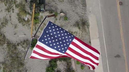 American Flag Waves in the Wind from Above